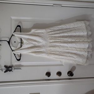 Lace dress.Above knee length. Button up top back with a portion top out